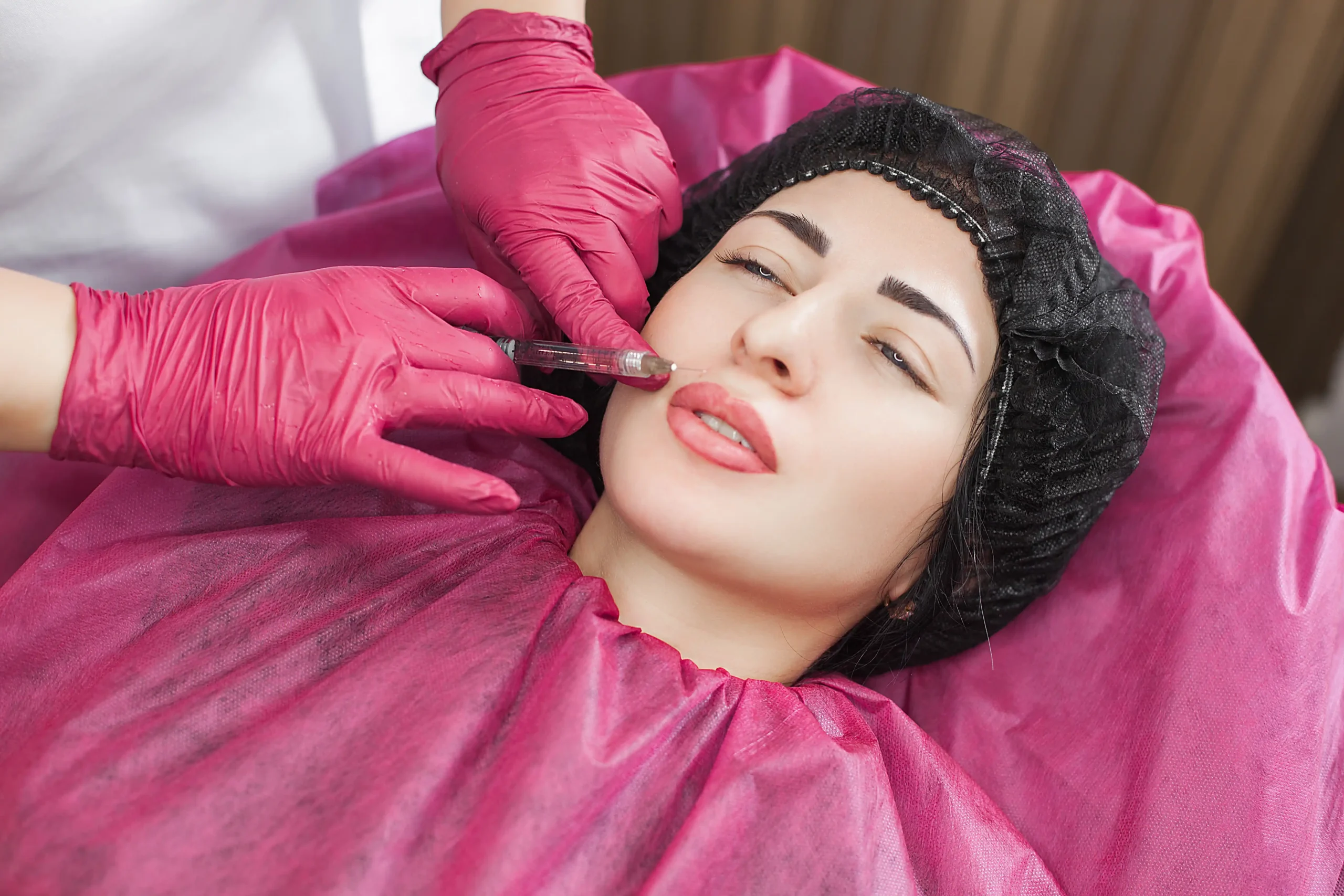 Woman receiving lip filler treatment at Unfiltered Medical Spa in Lehi, UT
