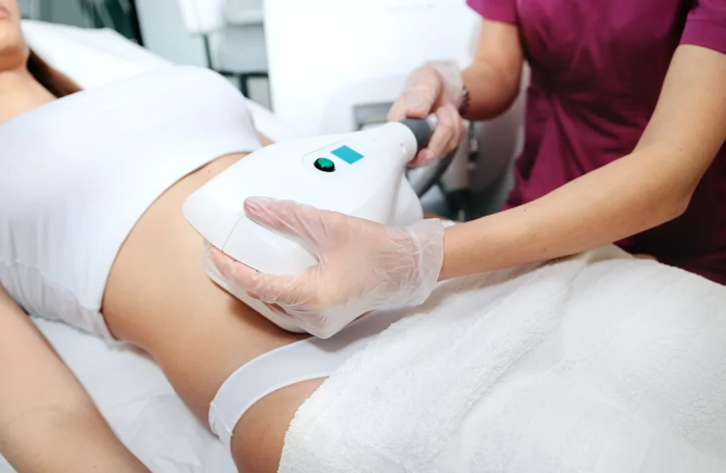 Nurse performing a T-Shape 2 body sculpting treatment on a woman’s in Lehi, UT